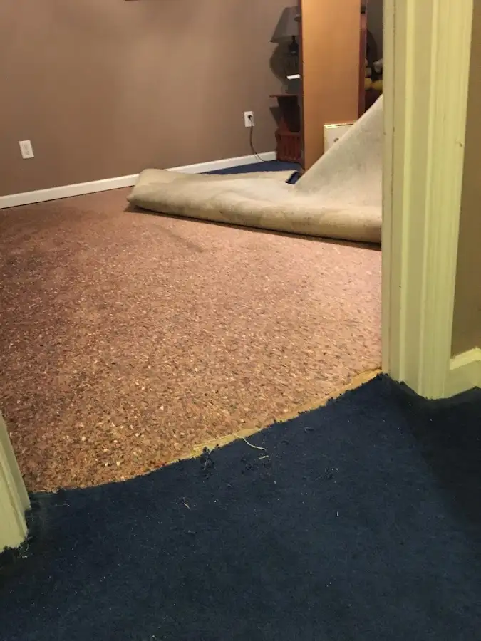 Carpet pad removal revealing water damage during Drying & Dehumidification in Turlock