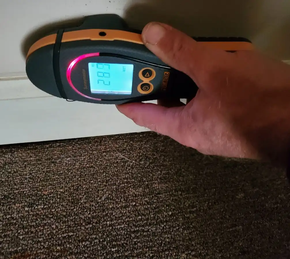 Moisture detection at baseboard during Storm Damage Restoration in Turlock